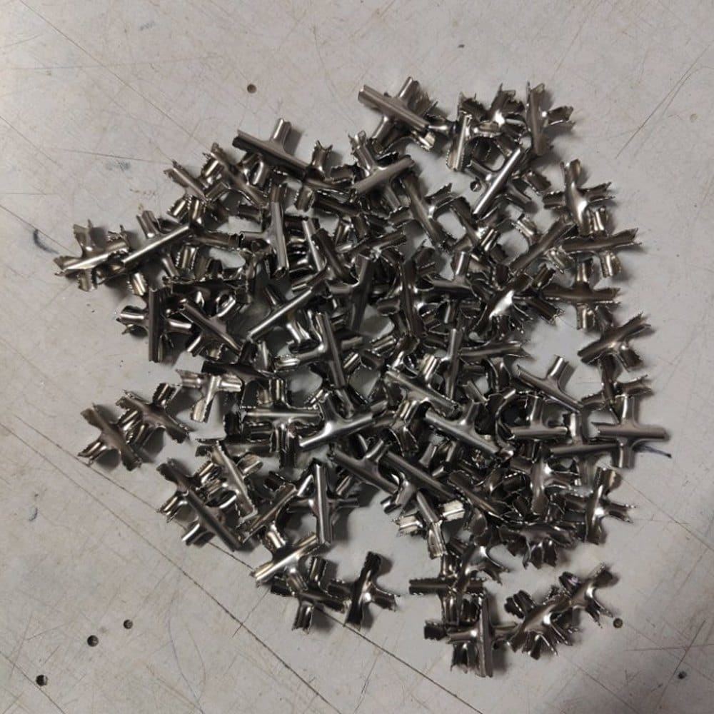 Pile of stainless steel cross stiffeners used to brace invisible grill cables