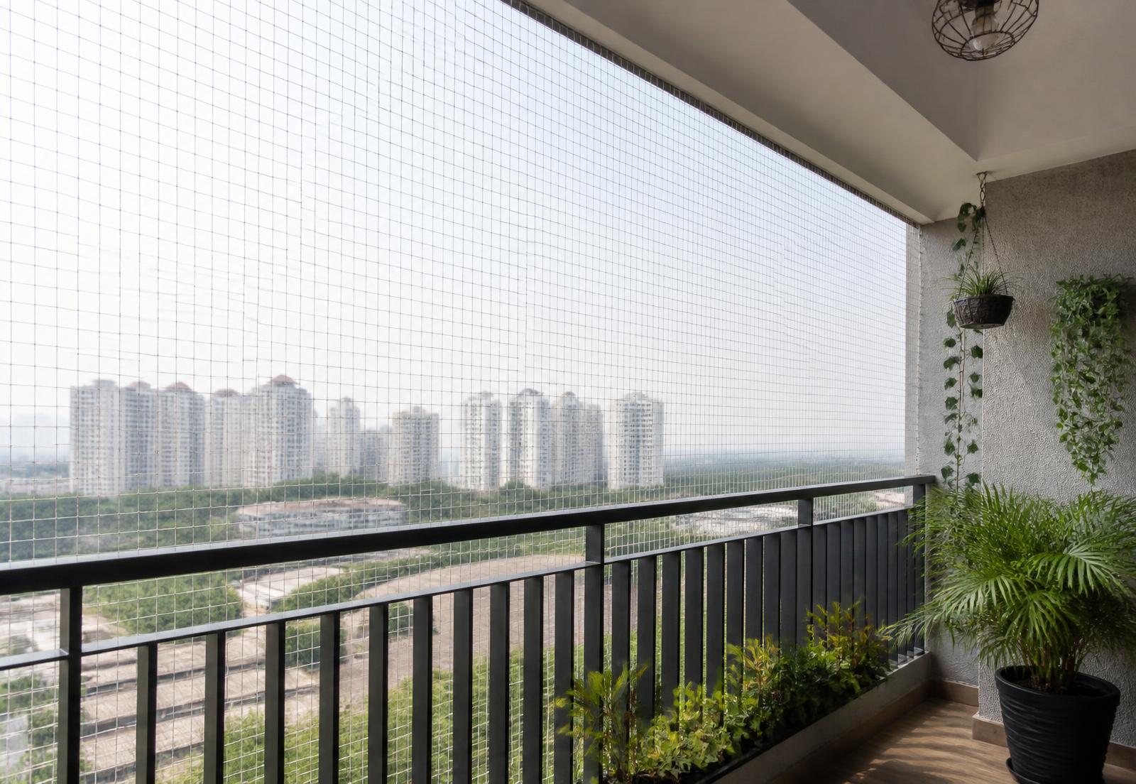 Pigeon net neatly installed across an apartment balcony in Maharashtra